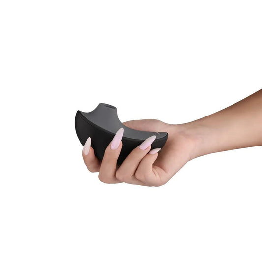 Svakom app controlled partner or solo air pulse adult toy with starlight projector lifestyle shot of item in hand on white background