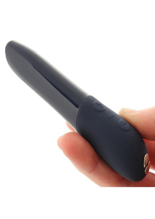 We-Vibe Tango X Rechargeable Clitoral Mini Bullet Vibrator - Midnight Blue - in woman's hand on a white background