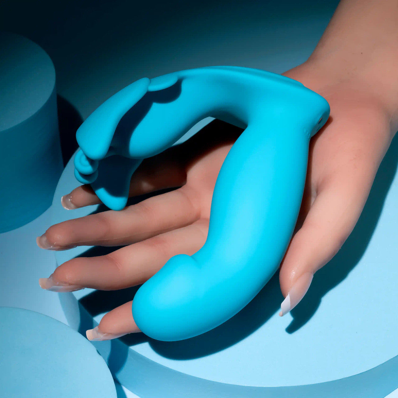 Evolved Novelties Spread Your Wings Butterfly Rabbit Vibrator in woman's hand to show true size.