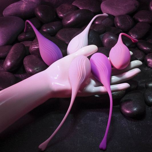 Evolved novelties tight delight kegel set in woman's hand to show size and texture.
