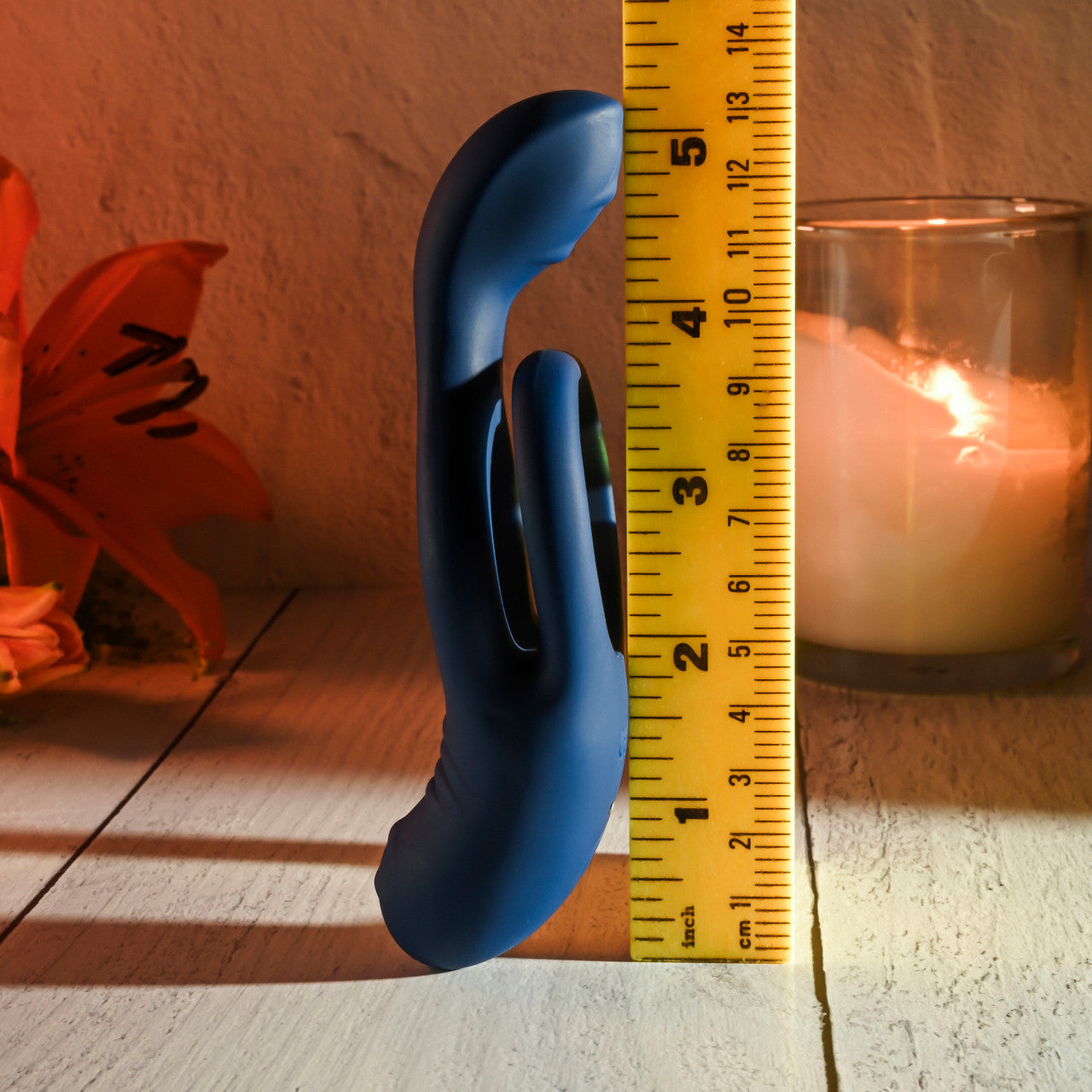 Evolved Novelties Ring Around the Rosy Vibrator next to yellow ruler to show size.