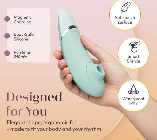 Woman holding Womanizer Next 3D Air Stimulator with Climax Control to show size and features. More power than a rose vibrator.