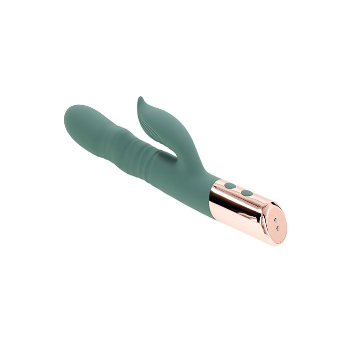 Evolved The Shimmy Dancing Twirling Rabbit thrusting vibrator on it's back to show charging connection for USB cord a white background