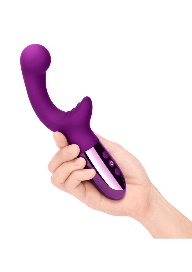 Le Wand XO Rechargeable Silicone Dual Stimulating Vibrator - Cherry held in a hand against a white background