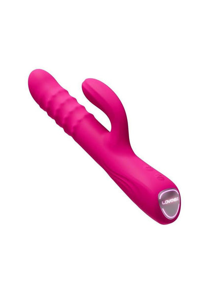 Pink Velvo Rotating Vibrating 3-in-1 Bluetooth App Compatible Rabbit Vibrator on its side showing glowing logo "Lovense" on a white background