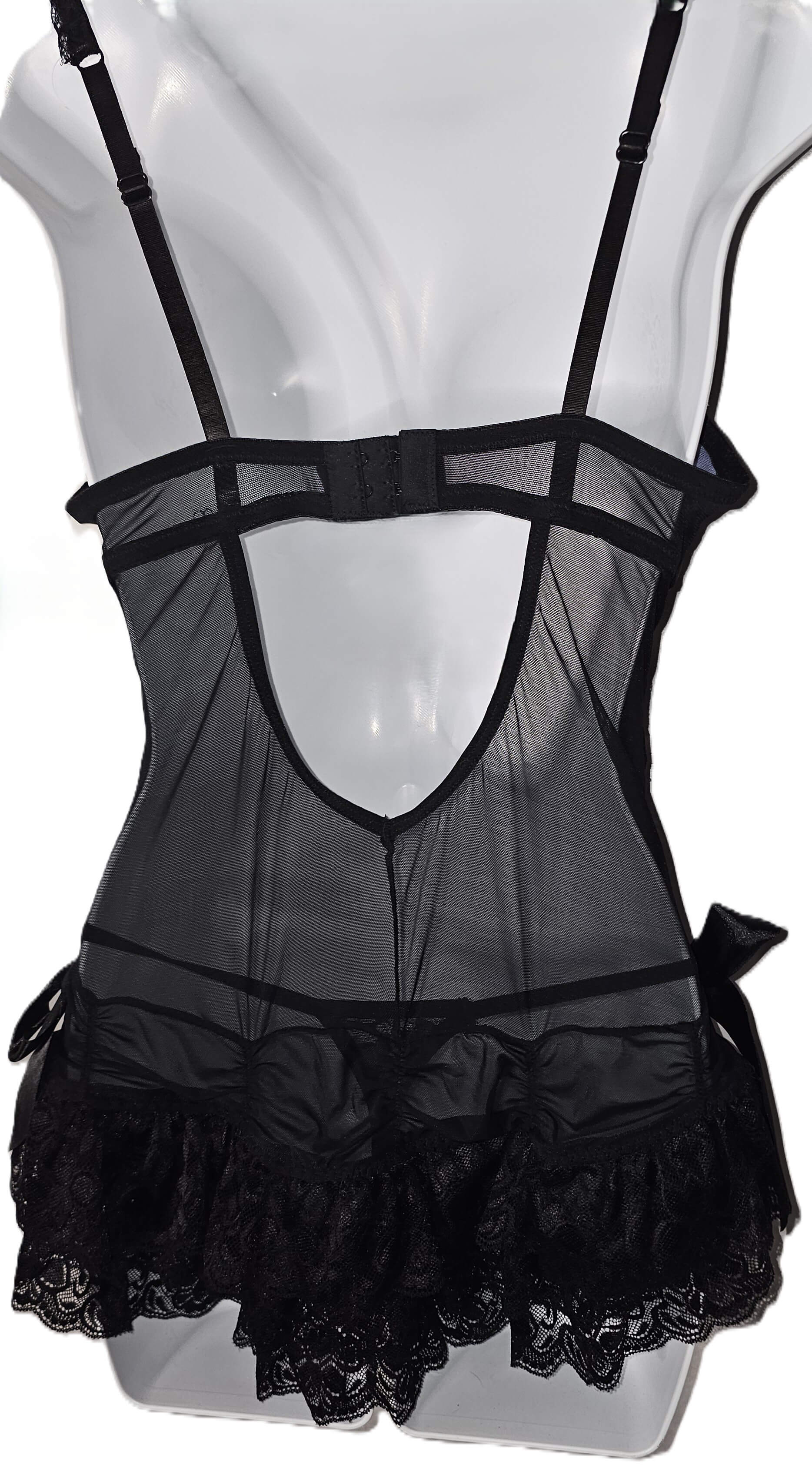 Black sheer mesh lingerie dress with thin shoulder straps, a deep open back, strappy harness-style detailing, and a ruffled lace hem, displayed on a white mannequin torso. Periwinkle Floral Lace Slip Dress & Thong Lingerie Set - Medium