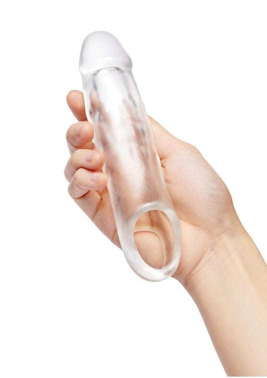 Size Up Classic Clear View Penis Extender with Ball Loop 1in in a woman's hand to show size on a white background