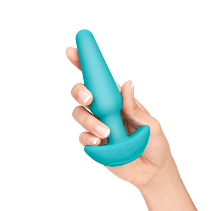 Medium-sized silicone plug with tapered tip for comfortable insertion in b-vibe anal education kit.