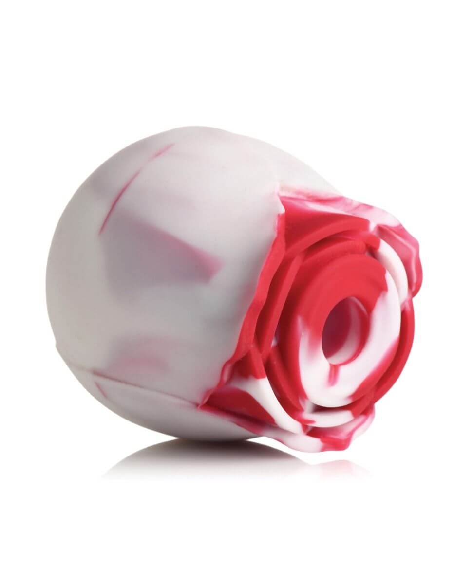 White and red rose-shaped vibrator on a white background
