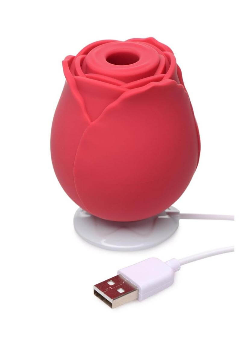Red rose-shaped USB rechargeable rose vibrator with a white background