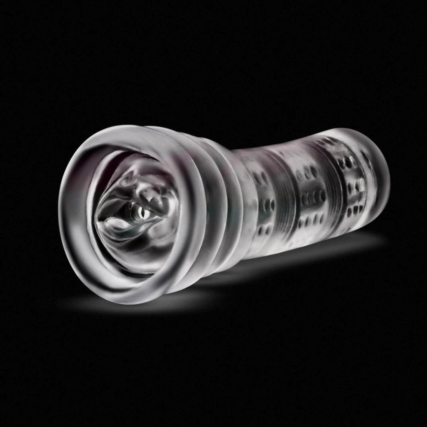 Clear fleshlight Blush rize luz glow in teh dark male stroker showing mouth entry with lips, on a black background