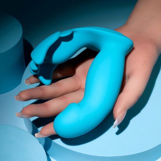 Evolved Novelties Spread Your Wings Butterfly Rabbit Vibrator in woman's hand to show true size.