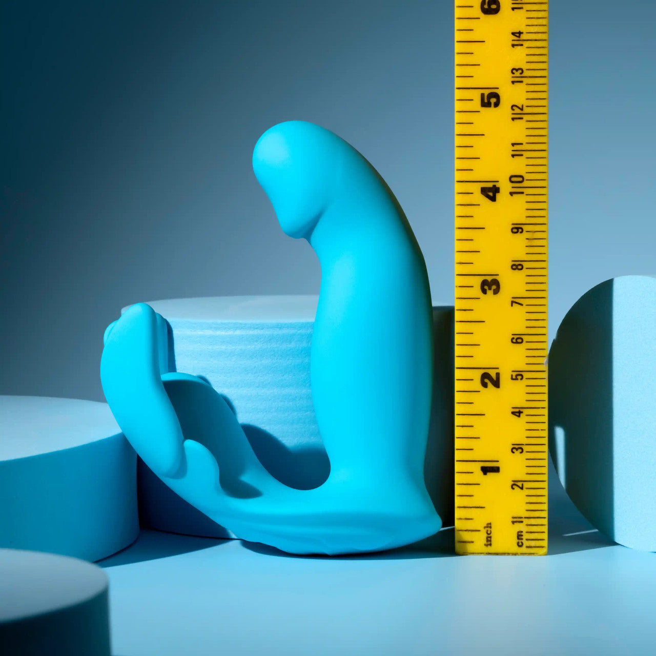 Evolved Novelties Spread Your Wings Butterfly Vibrator against tape measure to show true size.
