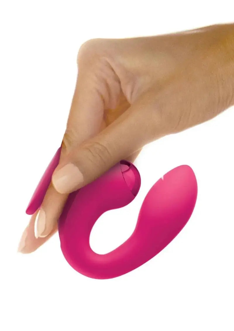 Hand holding a JimmyJane Dual Gripp gspot vibrator against a white background