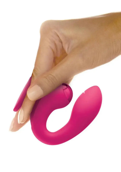 Hand holding a JimmyJane Dual Gripp gspot vibrator against a white background