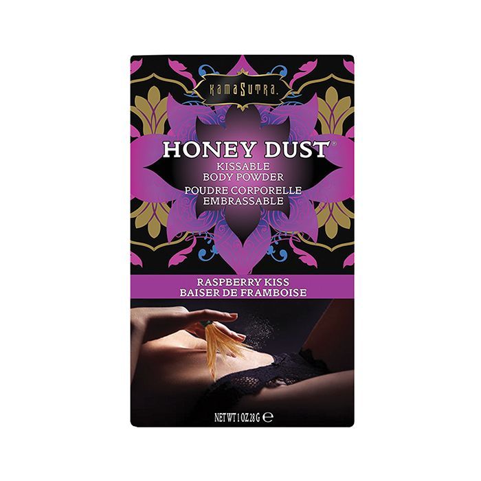 Kama Sutra Honey Dust Raspberry Kiss kissable body powder box with packaging featuring a woman dusting the powder on her body with a feather applicator on a white background