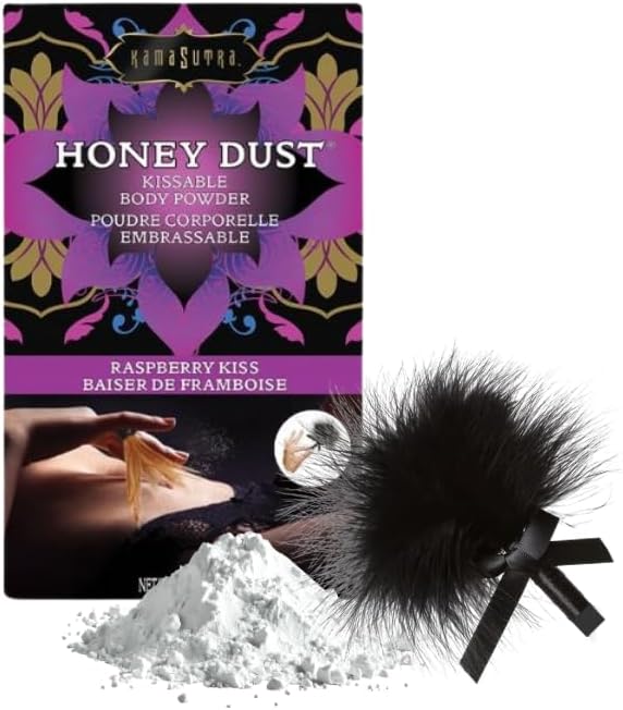 Kama Sutra Honey Dust Kissable Body Powder in Raspberry Kiss flavor, shown with its black and purple retail box, a pile of white powder, and a black fluffy applicator brush on a white background.