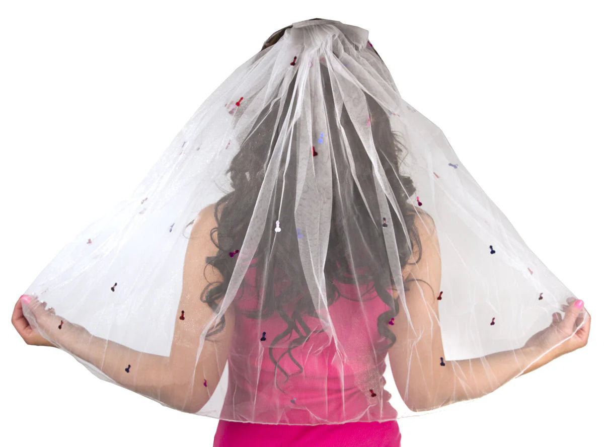 White gag gift bridal penis veil with multicolor penises attached,  held by a person wearing a pink top on a white background