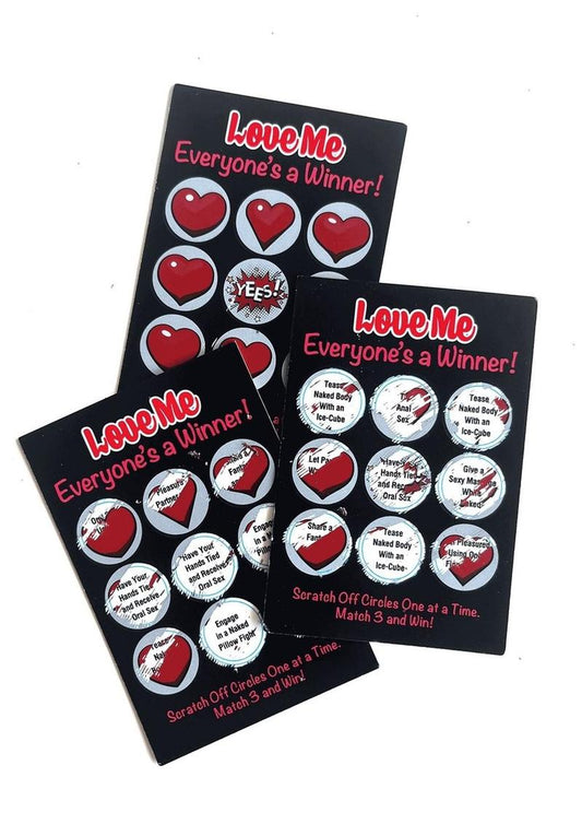 Three scratch-off cards from Love Me Lotto by Little Genie, with two of them showing potential prizes.  Each card says: 'Love Me Everyone's a Winner!' 