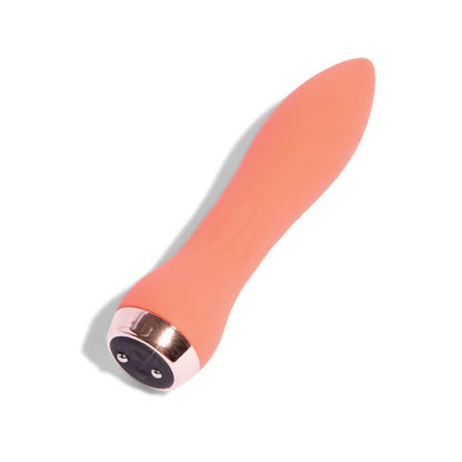 Nu Sensuelle 60sx Amp Silicone Bullet in coral on white background with recharging port visible