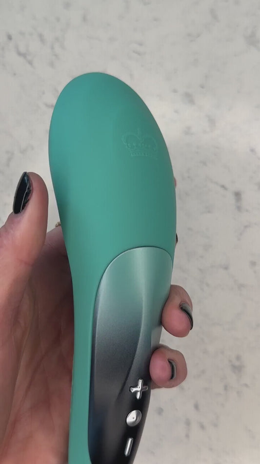 Hot Octopuss Pulse Queen Oscillating Wand How To Use Instructions with a woman speaking and holding item against a granite background