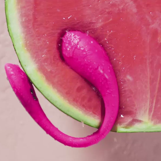 Pink Lovense Lush Mini Remote-Controlled Small & Powerful G-Spot Egg Vibrator inside a watermelon showing it's strong vibration power.