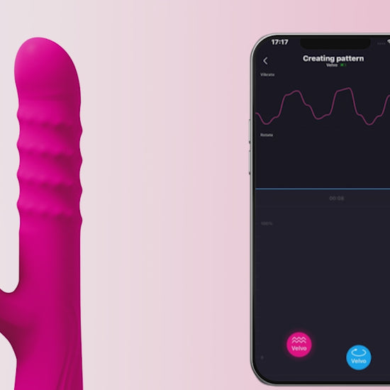 Pink Lovense Velvo Rabbit Vibrator next to smartphone showing the app functionality on a light background