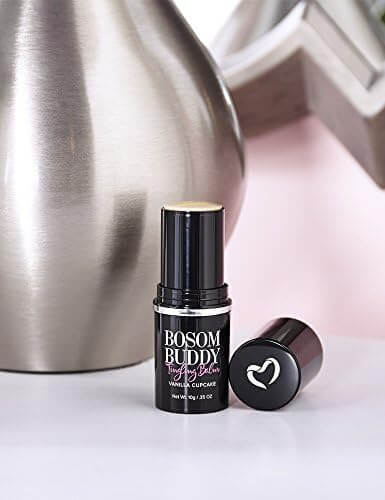 Bosom Buddy Vanilla cupcake lip balm  product by Pure Romance with a heart-shaped cap on a white surface