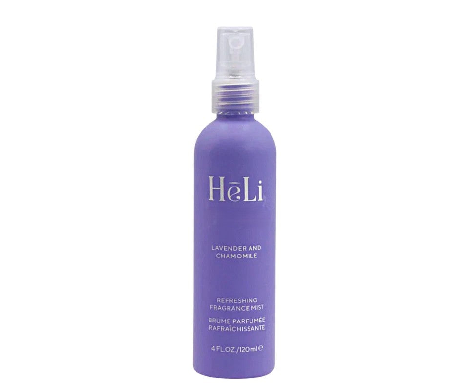 Purple bottle of Pure Romance Heli Lavender and Chamomile refreshing fragrance mist on a white background