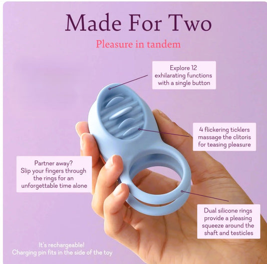 Pure Romance Made For Two vibrating c-ring with tongue in woman's hand to show size and features.