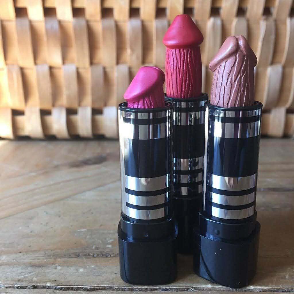 Penis Lipstick in different shades on blurred background
