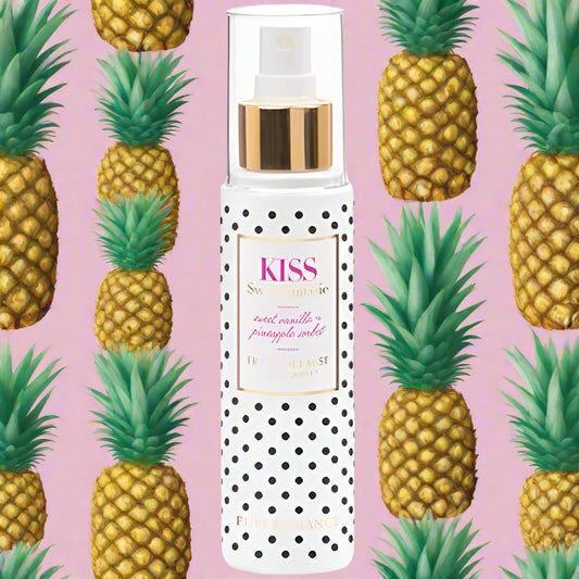 Pure Romance Sweet Fantasie Spray bottle with polka dot design and 'Kiss' branding on a white background