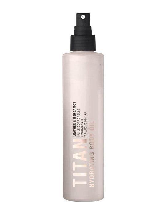 Titan hydrating leather bergamot body oil bottle on a white background by Pure Romance