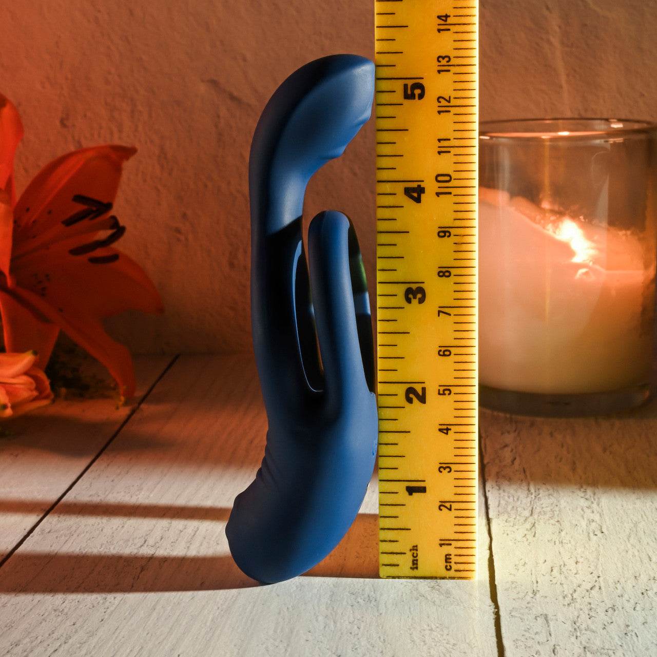 Evolved Novelties Ring Around the Rosy Vibrator next to yellow ruler to show size.