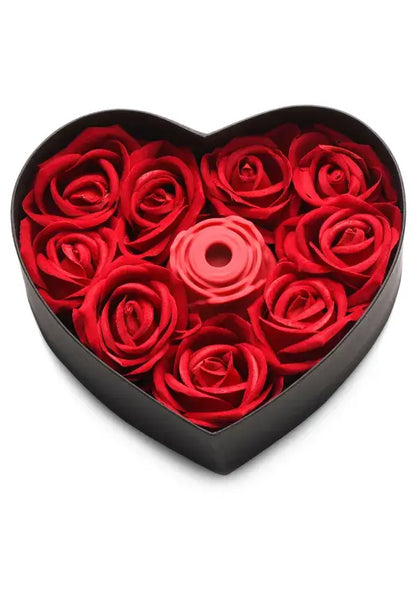 Heart-shaped box filled with red roses  and a Bloomgasm Rose Vibrator on a white background