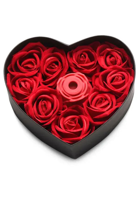 Heart-shaped box filled with red roses  and a Bloomgasm Rose Vibrator on a white background