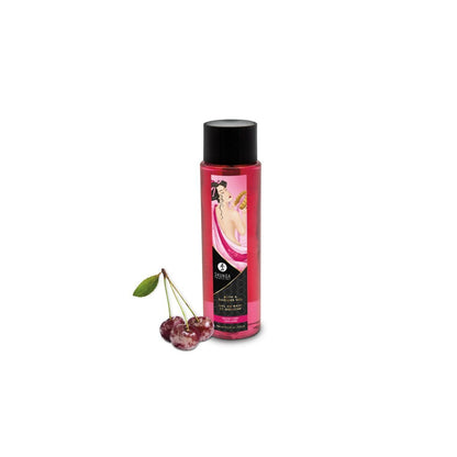 A bottle of Shunga Bath & Body Gel de Bain in Frosted Cherry with frosted cherries next to bottle featuring a black cap and a vintage-style oriental label illustration on a white background.
