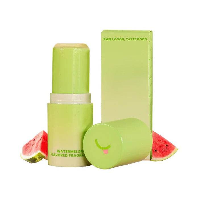 Sweetums Sweet Spot watermelon flavored Scented fragrance stick with slices of watermelon in the background.