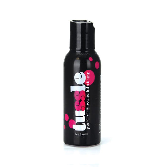 Tussle Premium Silicone Lubricant bottle FDA cleared long lasting formula front of black bottle with pink and white writing.