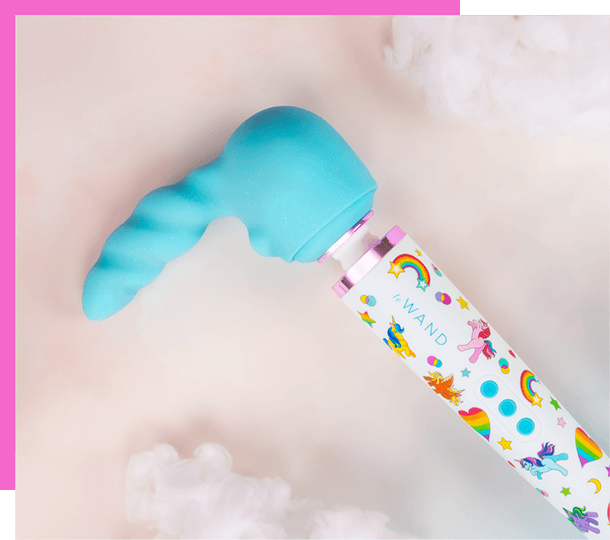Le Wand Unicorn Wand Limited Edition Set wand vibrator with colorful packaging on a light pink background featuring the unicorn attachment