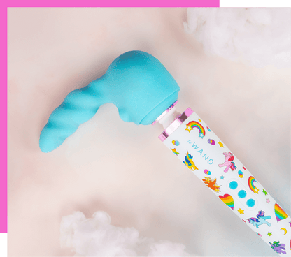 Le Wand Unicorn Wand Limited Edition Set wand vibrator with colorful packaging on a light pink background featuring the unicorn attachment